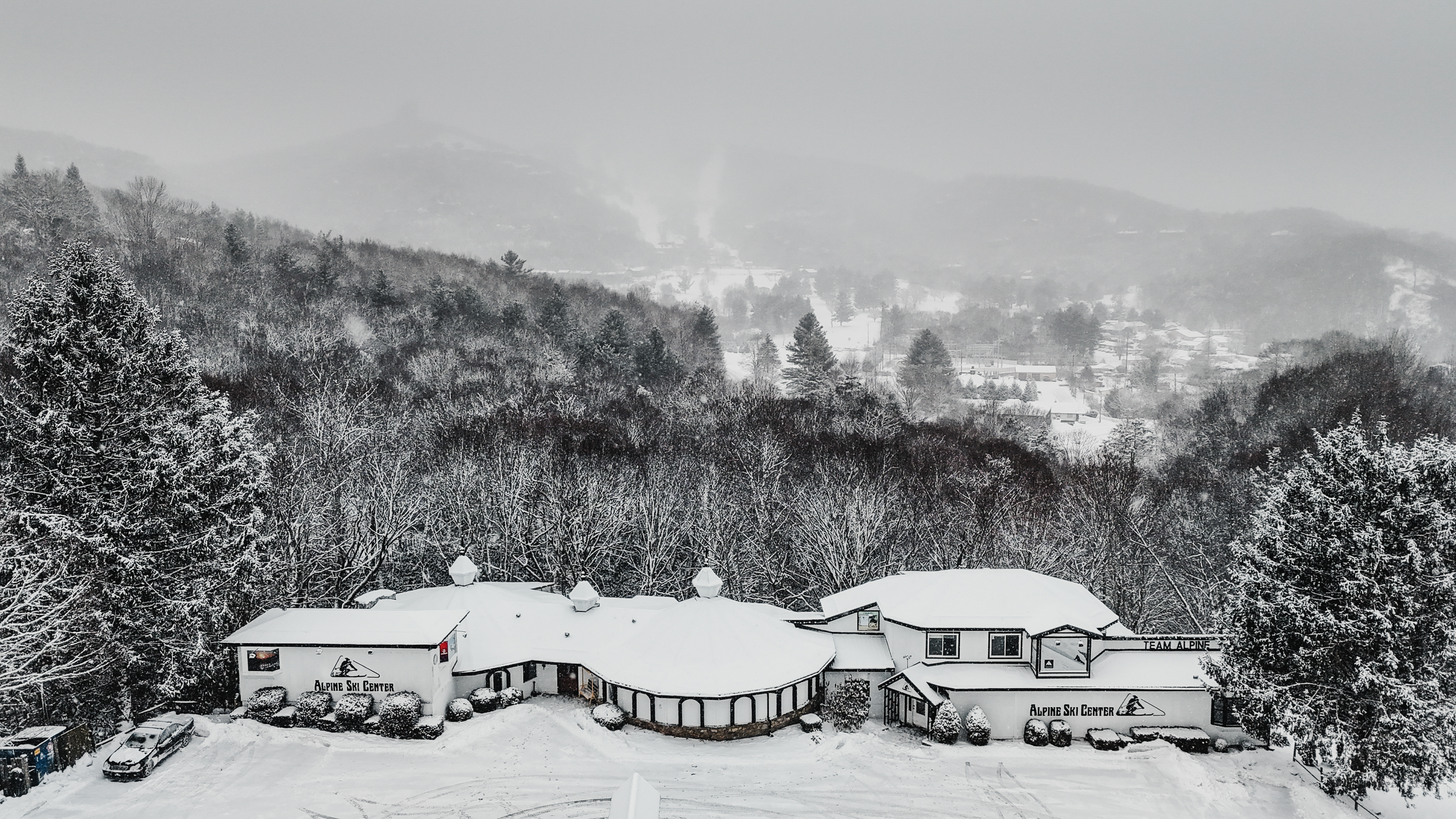 Alpine Ski Center Banner Elk location covered in snow with mountain backdrop